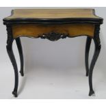 A CONTINENTAL WALNUT AND EBONISED FOLD OVER CARD TABLE, 78cm high, 82cm wide and 40cm deep Condition