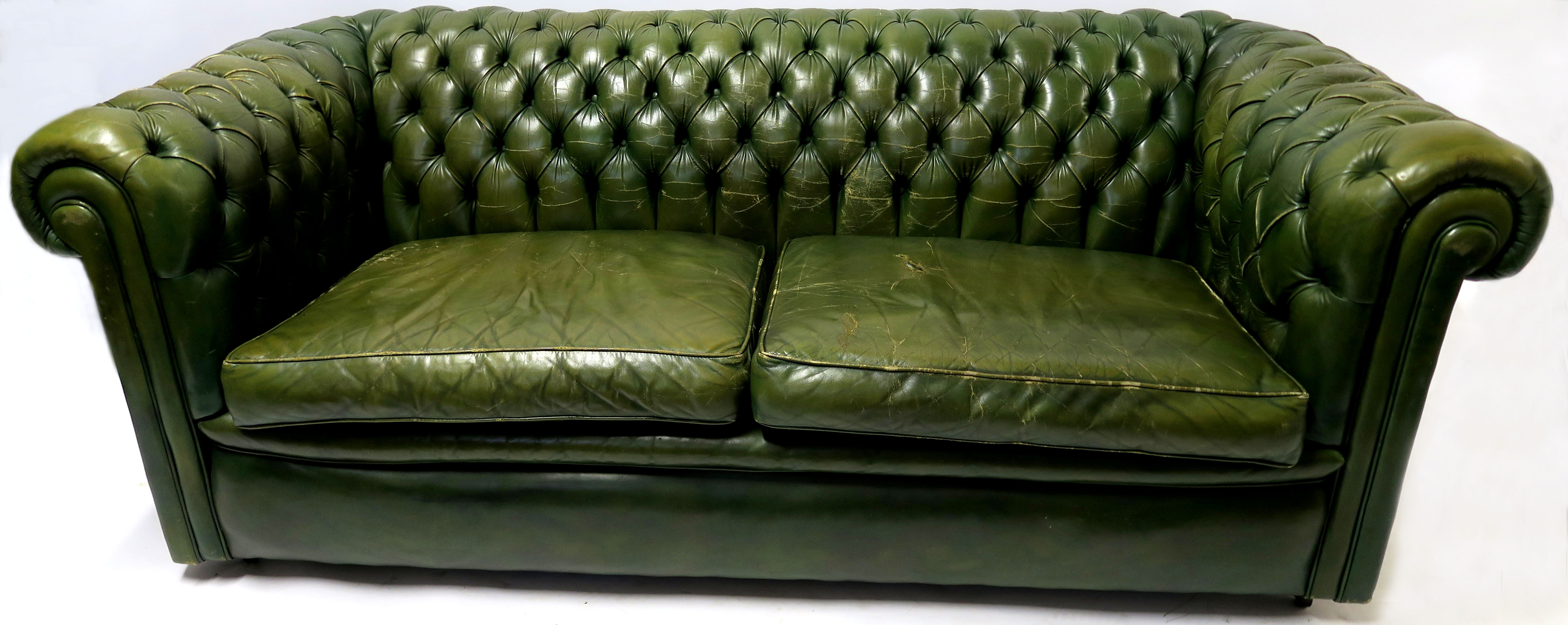 A GREEN LEATHER BUTTON-BACK SETTEE 66cm, high,186cm wide, 85cm deep Condition Report: Available upon