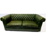 A GREEN LEATHER BUTTON-BACK SETTEE 66cm, high,186cm wide, 85cm deep Condition Report: Available upon
