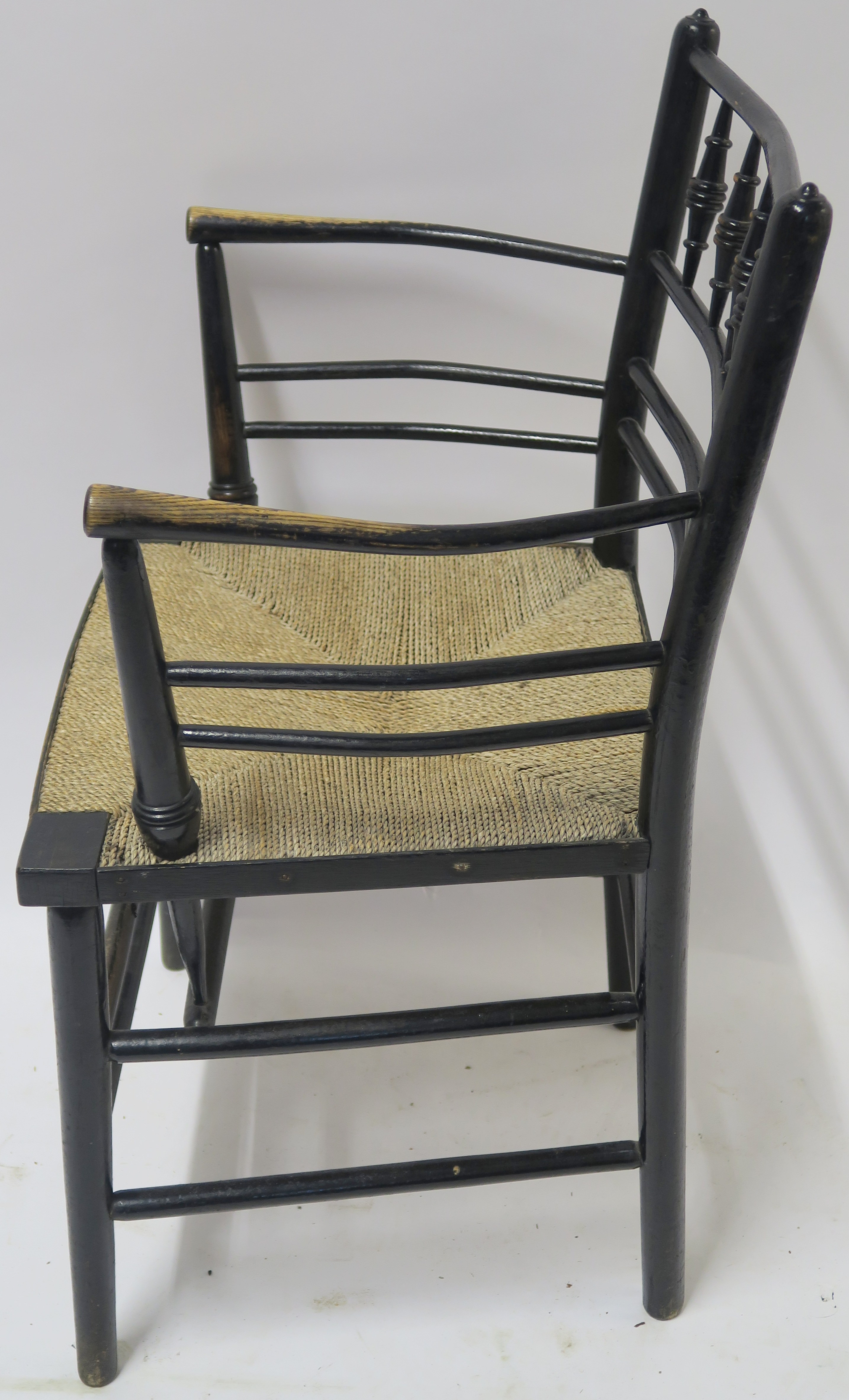 A WILLIAM MORRIS EBONISED SUSSEX CHAIR of standard form with rush seat 85cm high Condition Report: - Image 5 of 7