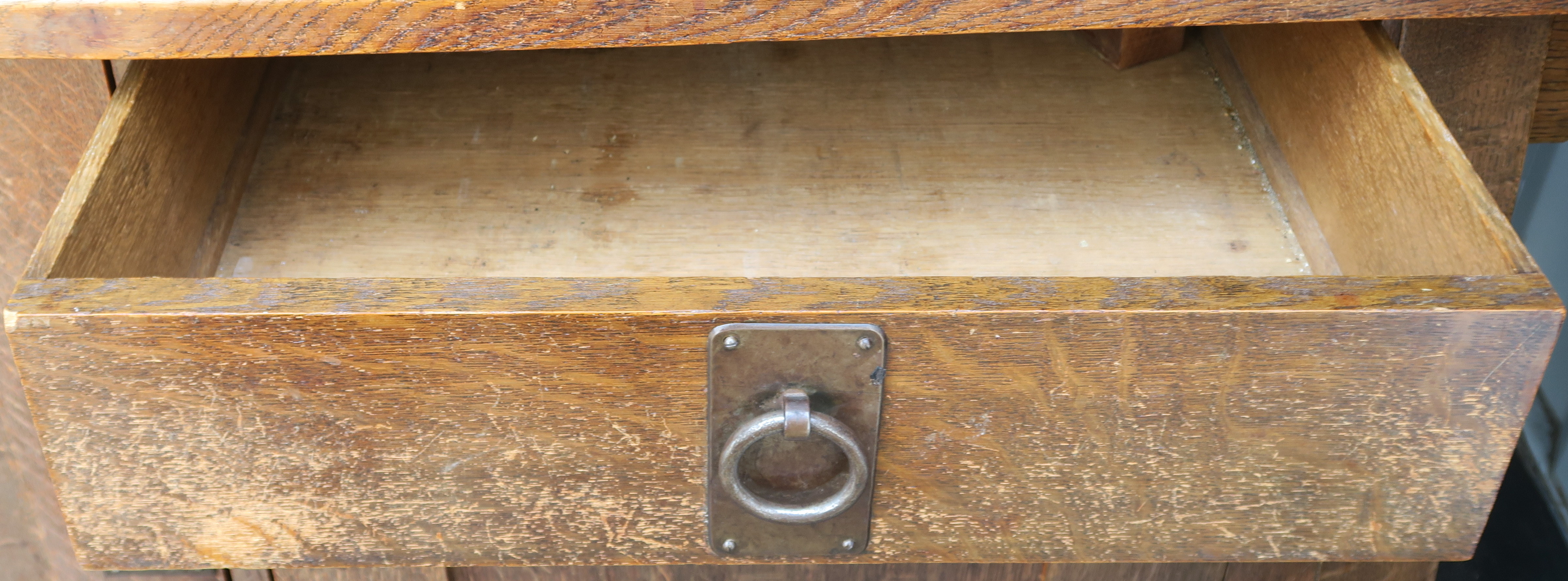 A LIBERTYS OF LONDON OAK ARTS AND CRAFTS SIDEBOARD the overhanging cornice above a leaded glass - Image 15 of 15