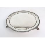 A SILVER CARD TRAY BY STOWER & WRAGG LTD Sheffield, 1935 of scalloped circular form with beaded