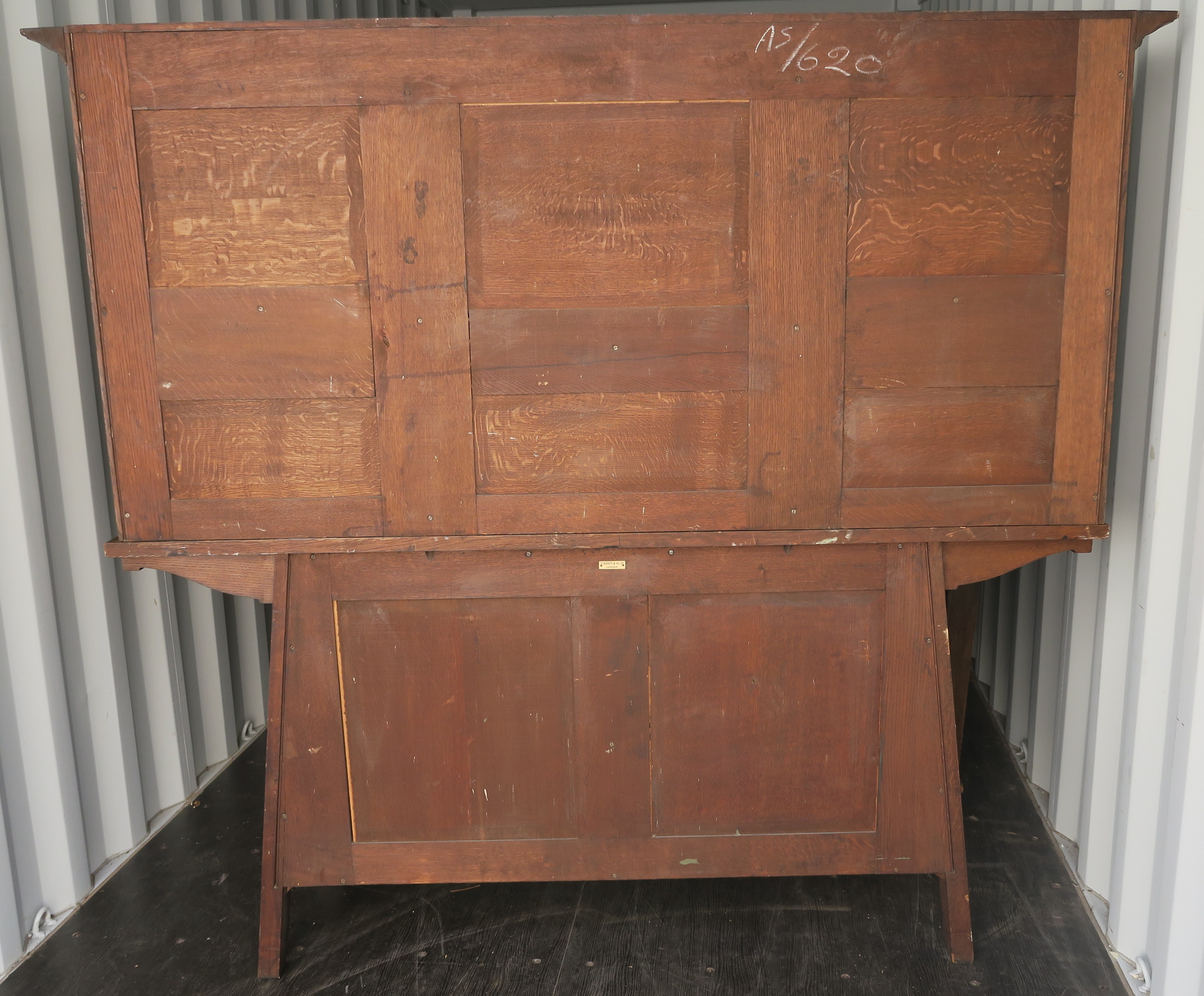 A LIBERTYS OF LONDON OAK ARTS AND CRAFTS SIDEBOARD the overhanging cornice above a leaded glass - Image 6 of 15