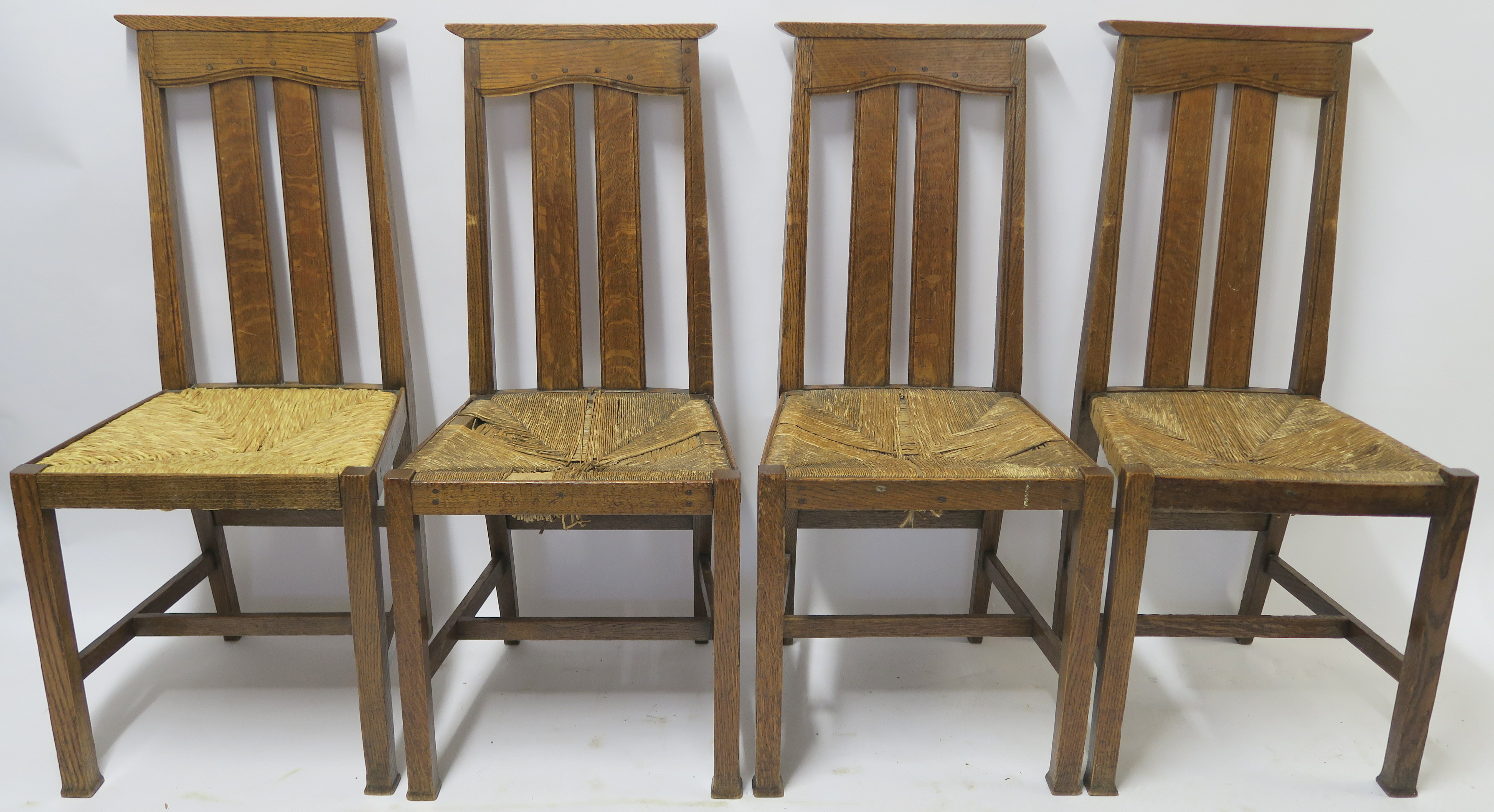 A SET OF SIX ARTS AND CRAFTS DINING CHAIRS WITH RUSH SEATS 103cm and 100cm high and two other chairs