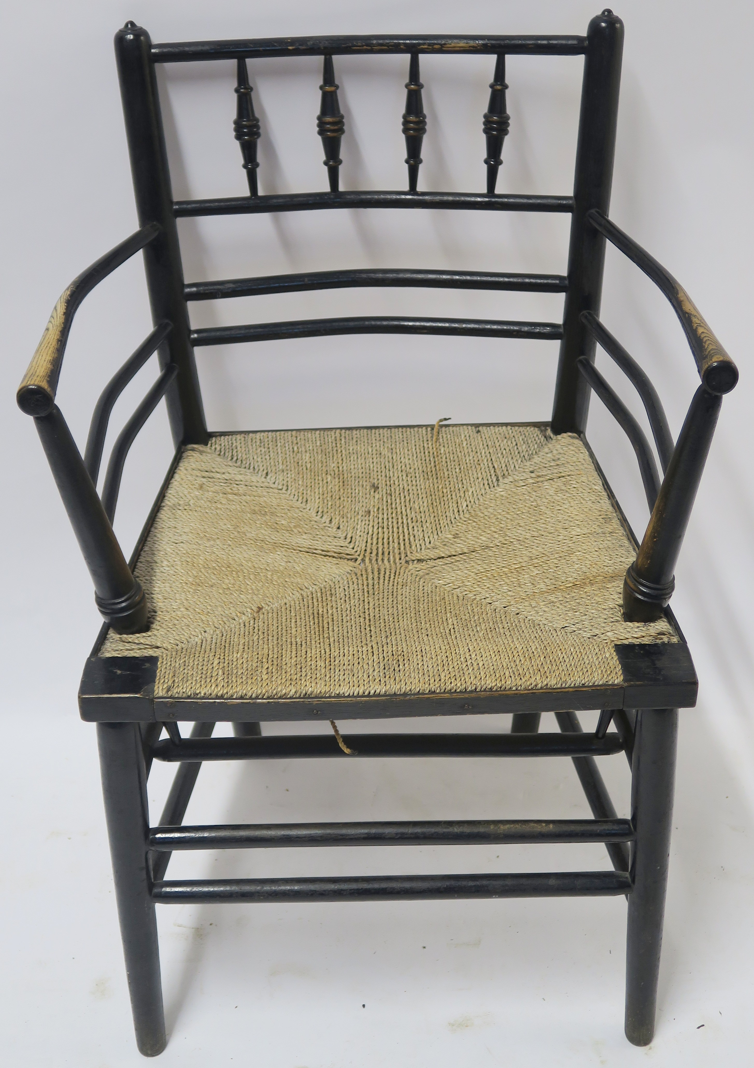 A WILLIAM MORRIS EBONISED SUSSEX CHAIR of standard form with rush seat 85cm high Condition Report: - Image 2 of 7