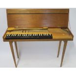 A SMALL TEAK TABLE PIANO stamped John Barnes 1963, 73cm high, 104cm wide, 30cm deep Condition