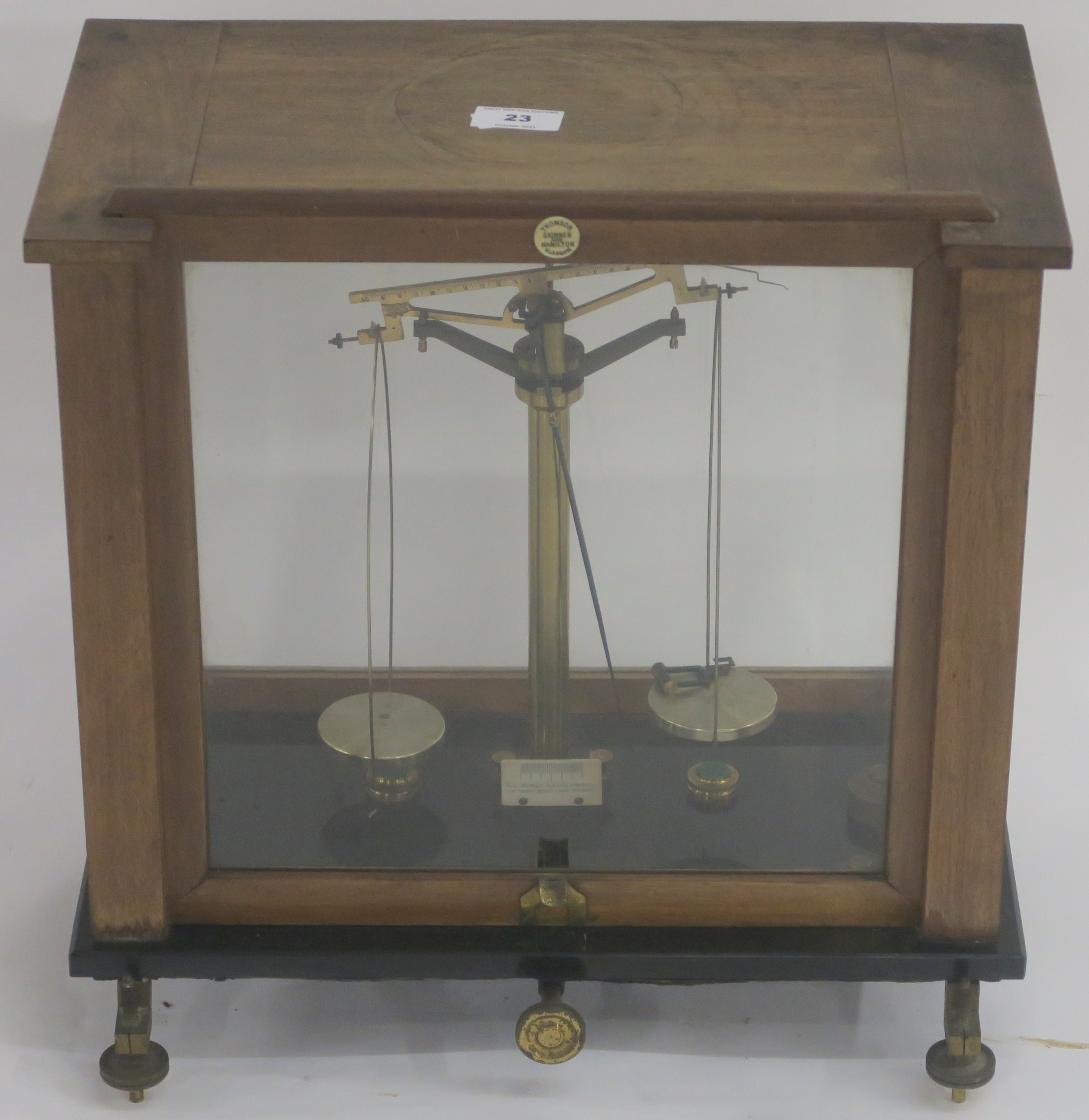 A cased set of scales by Thomson, Skinner and Hamilton, Glasgow, 43cm high x 43cm wide x 26cm deep