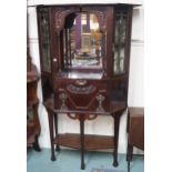 A mahogany display cabinet with open shelf with mirror back flanked by two glazed doors, drop
