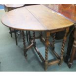 An oak gateleg table with barley twist supports, 75cm high x 88cm wide x 36cm deep Condition Report: