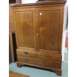 A Victorian mahogany wardrobe with two doors over lower drawers, 178cm high x 129cm wide x 64cm deep