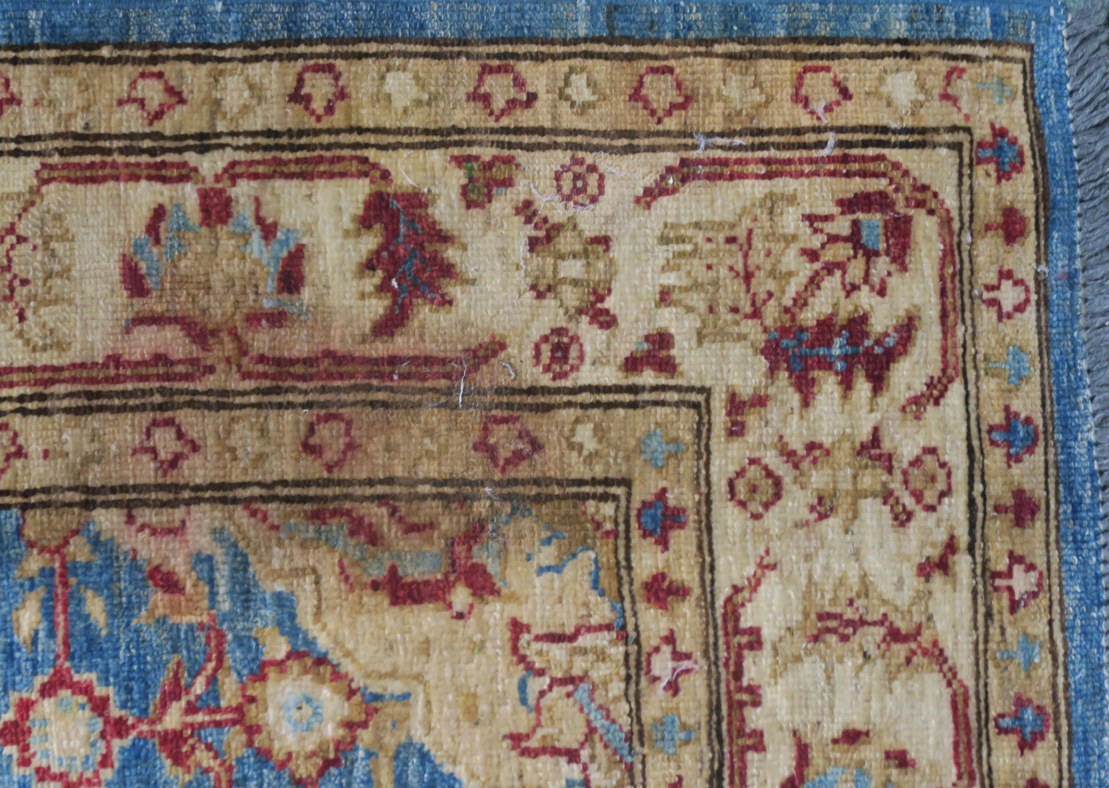 A blue ground eastern rug with central medallion and allover floral design, 187cm x 125cm - Image 3 of 4