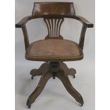 An early 20th Century oak swivel office chair Condition Report: Available upon request