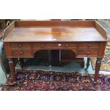A Victorian mahogany desk with five drawers with turned handles , 85cm high x 122cm wide x 56cm deep