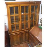 A Modern display cabinet with glazed doors over a base with three drawers, 197cm high x 140cm wide x