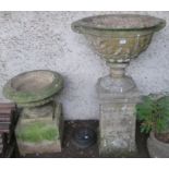 A large reconstituted stone urn on stand, 126cm high and a smaller urn on stand 71cm high (2)