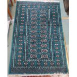 A green ground Bokhara rug and a pink ground Chinese rug, 168cm x 93cm (2) Condition Report: