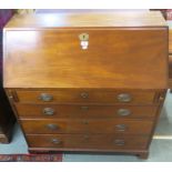 A reproduction mahogany bureau with four graduating drawers on bracket feet, 103cm high x 95cm