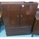 A mahogany tallboy with two doors over two drawers, 122cm high x 84cm wide x 47cm deep Condition