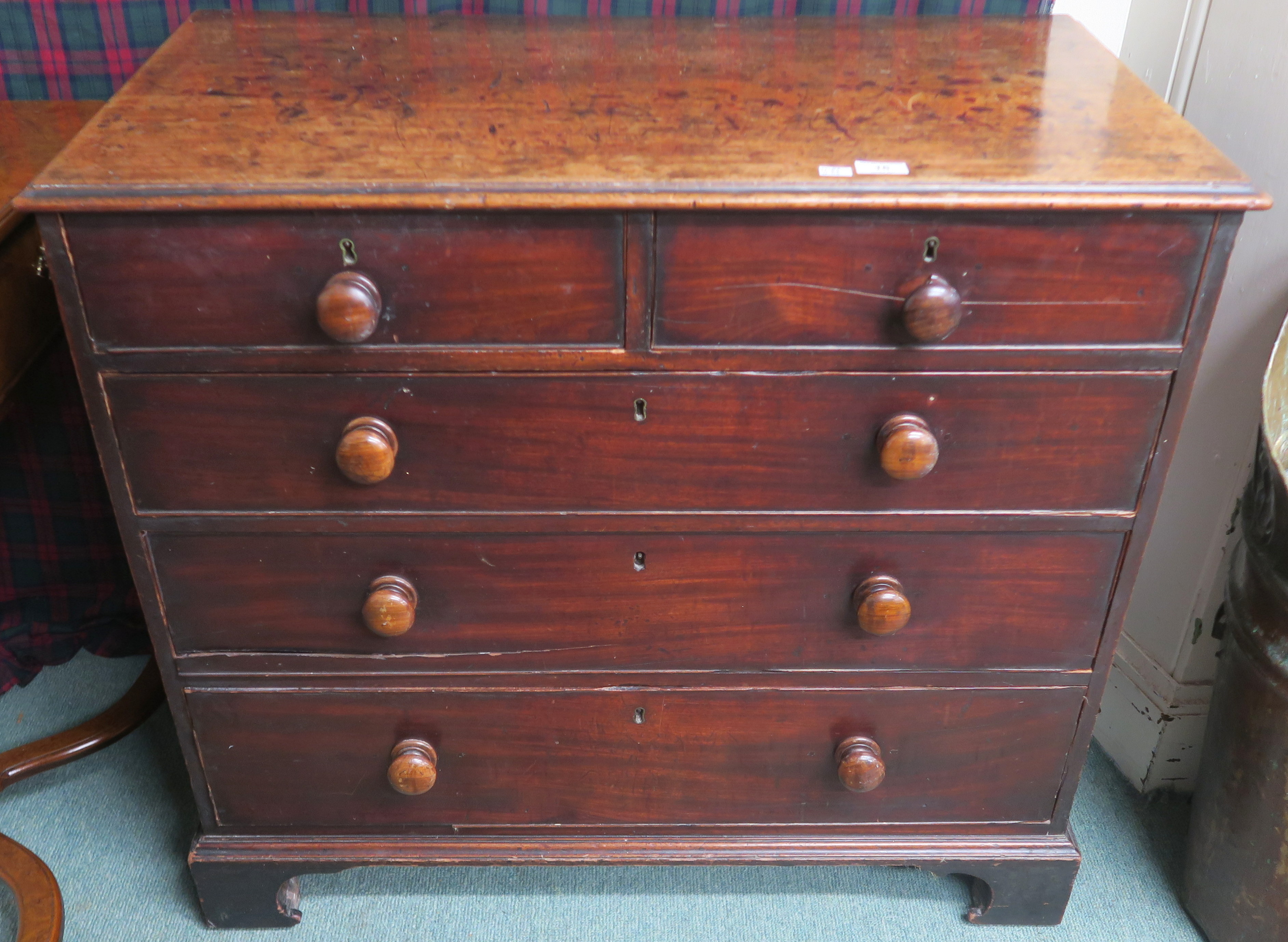 A Georgian mahogany two over three chest with turned handles on bracket feet, 86cm high x 94cm