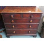 A Georgian mahogany two over three chest with turned handles on bracket feet, 86cm high x 94cm