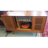 A Mid Century teak stereogram with Garrard model 3000 turntable and HMV transistor stereo radio,