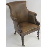A Victorian mahogany armchair upholstered in brown vinyl Condition Report: Available upon request