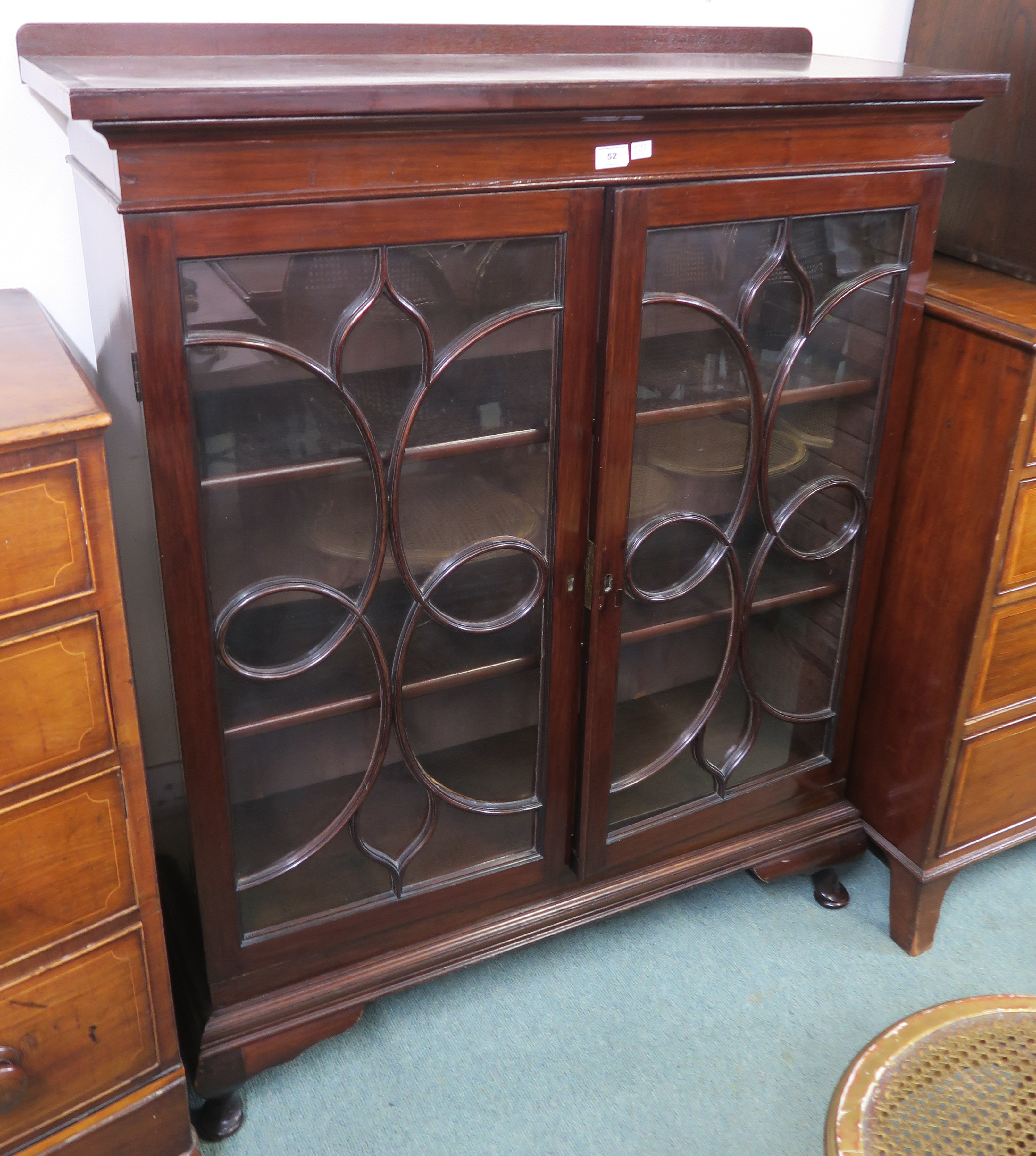 A mahogany bookcase with two glazed doors, 129cm high x 105cm wide x 37cm deep Condition Report:
