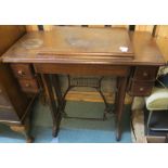 A treadle Singer sewing machine (def) Condition Report: Available upon request