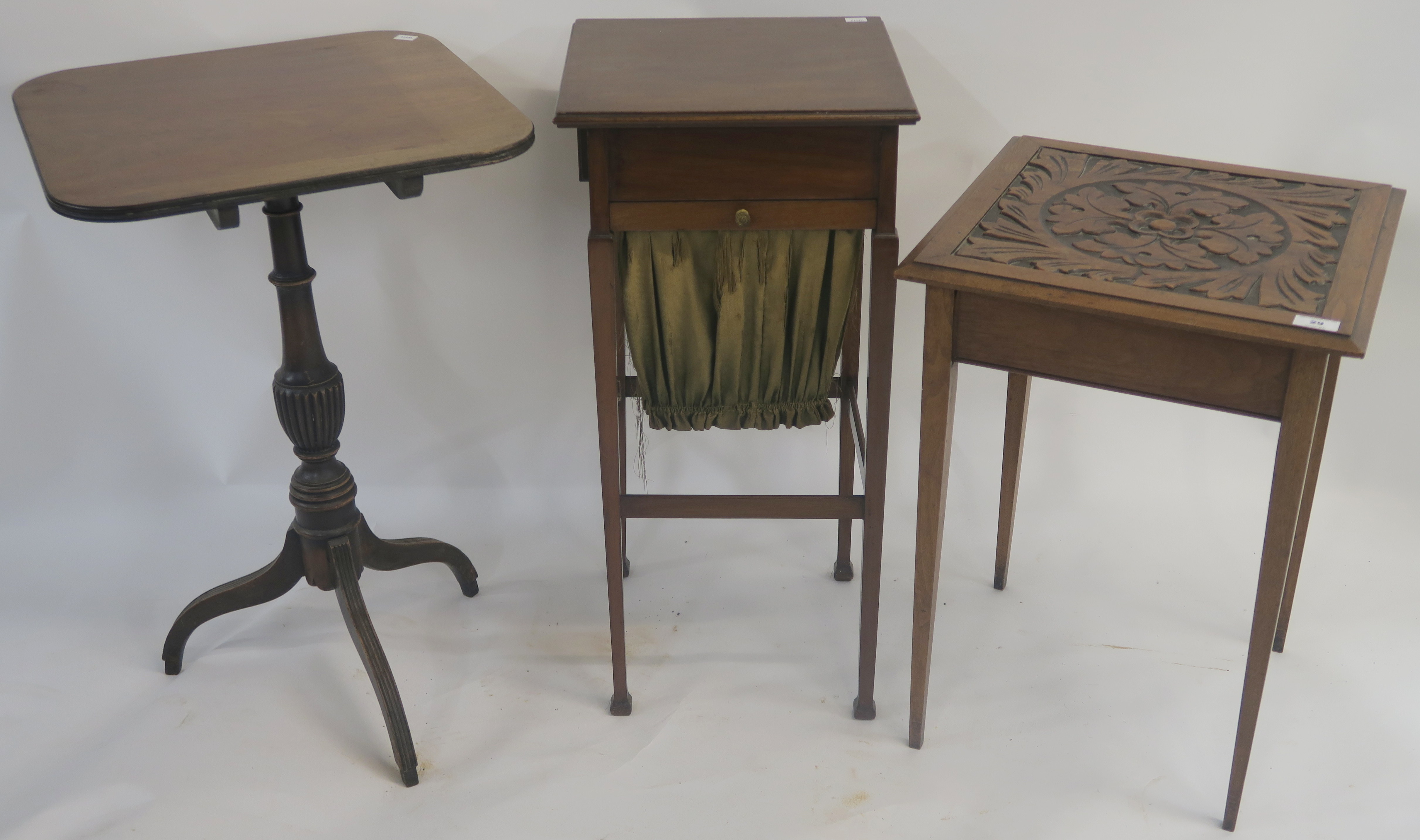 A mahogany side table with carved top, a mahogany tilt top occasional table and a mahogany work