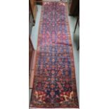 A blue ground Hamadan runner with allover geometric design, 297cm x 77cm Condition Report: Available