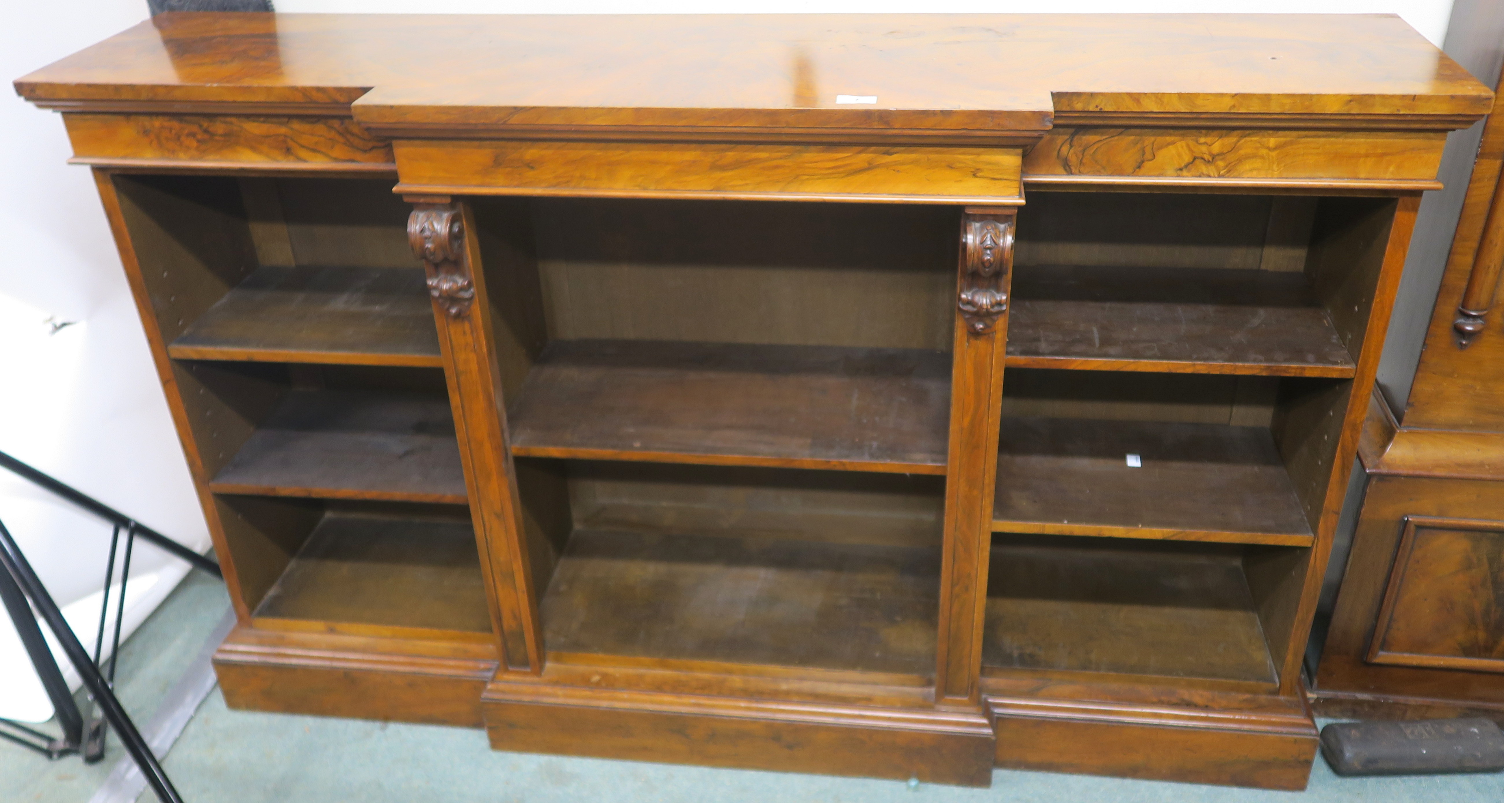 A Victorian walnut open break front bookcase, 94cm high x 153cm wide x 38cm deep Condition Report: