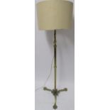 A brass converted adjustable standard lamp on tripod base with claw feet Condition Report: Available