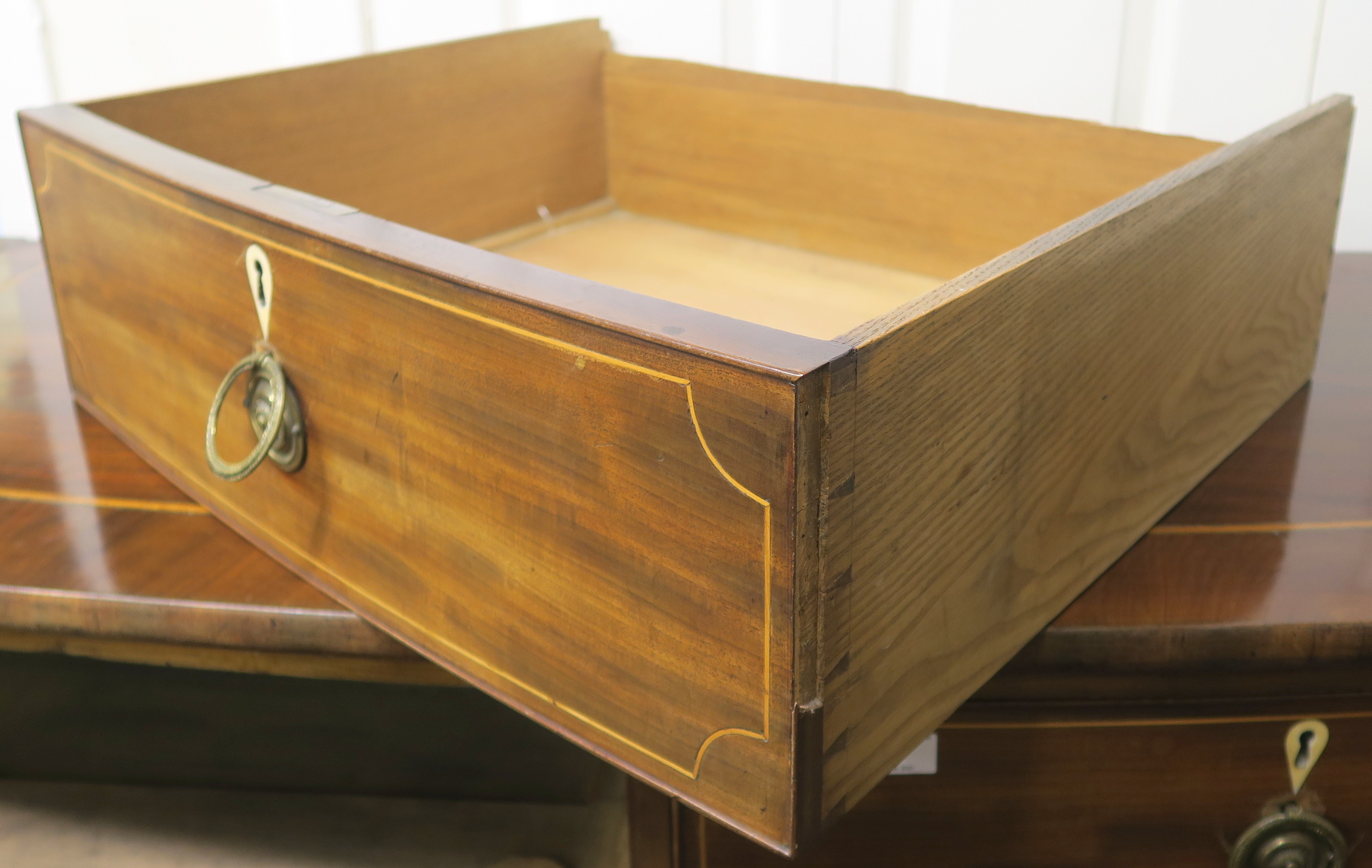 A 19th Century inlaid mahogany two over three bow front chest on bracket feet, 113cm high x 124cm - Image 3 of 5