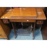 A Singer treadle sewing machine and an open bookcase (2) Condition Report: Available upon request