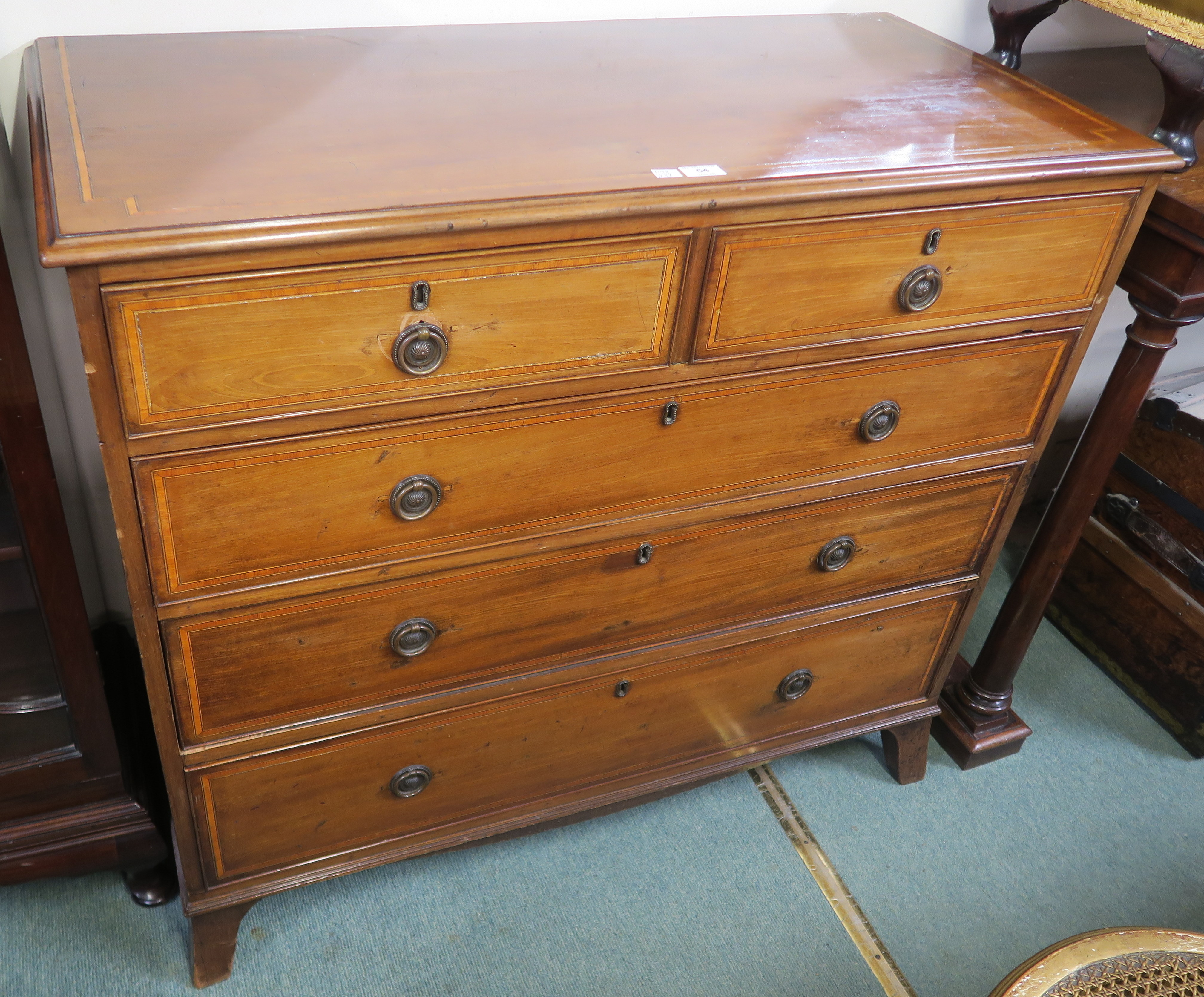 A Georgian inlaid mahogany two over three chest of drawers on bracket feet, 98cm high x 110cm wide x