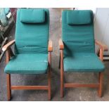 A pair of modern teak garden chair with cushions (4) Condition Report: Available upon request