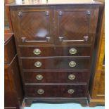 A Wyllie and Lochhead mahogany tallboy with two doors over four drawers on bracket feet, 127cm