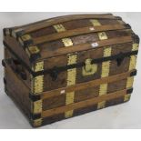 A wood bound Saratoga trunk, 55cm high x 72cm wide x 44cm deep Condition Report: Available upon