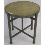 A brass topped folding table 65cm high x 60cm diameter Condition Report: Available upon request