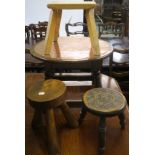 A 20th century oak occasional table with copper top and three assorted wooden footstools Condition
