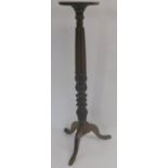*WITHDRAWN* A 20th century carved mahogany torchere on tripod base, 141cm high