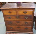 A 19th century oak two over three chest of drawers with brass handles. Condition Report: Available