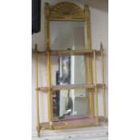 A gilt framed three tier mirror back display shelf and a gilt framed water colour of a bridge signed