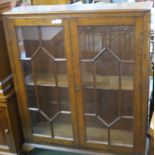 A Victorian oak glazed display cabinet, 129cm high, 104cm wide and 29cm deep Condition Report: