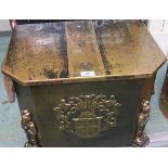 A brass coal depot decorated with armorial seal and figures of knights, 39cm high, 50 cm wide and