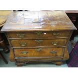 A 19th century walnut veneered four drawer bombe commode on bracket feet (Muirhead Moffat & Co) 82cm