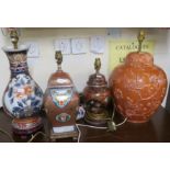 A lot comprising four assorted ceramic table lamps and modern wood framed wall mirror (5)