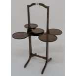 An Edwardian mahogany "Monoplane" folding cake stand 78cm high Condition Report: Available upon