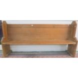An early 20th century pine church pew 94cm high x 192cm wide x 43cm deep Condition Report: Available