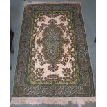 An Eastern style floral and foliate pattern green ground rug 186cm long x 126cm wide Condition